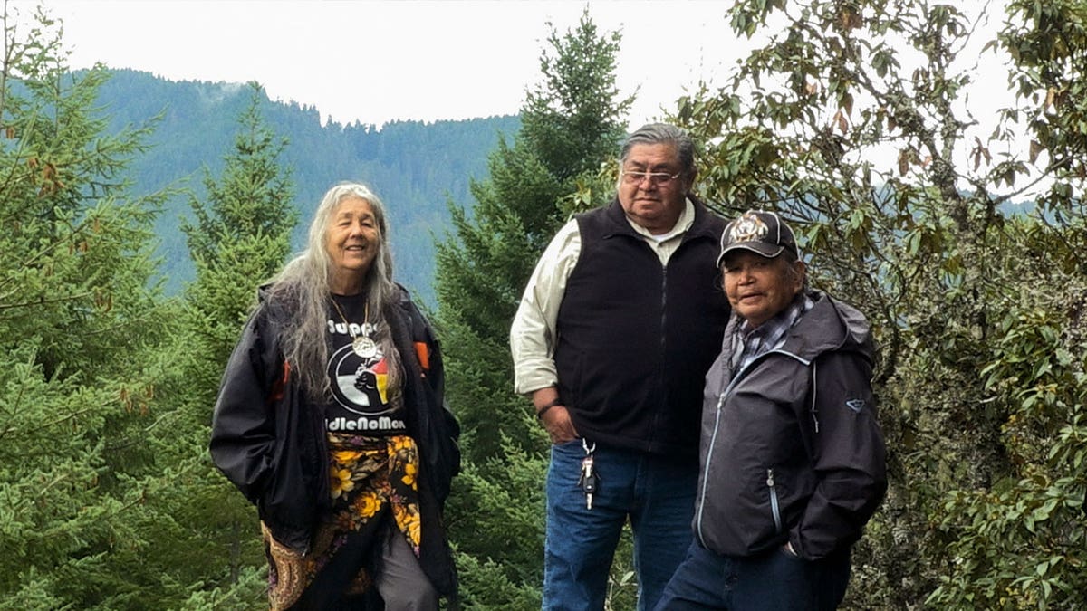 native americans stand for photo