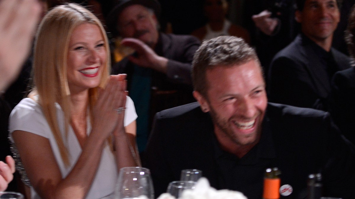 Gwyneth Paltrow and Chris Martin laughing
