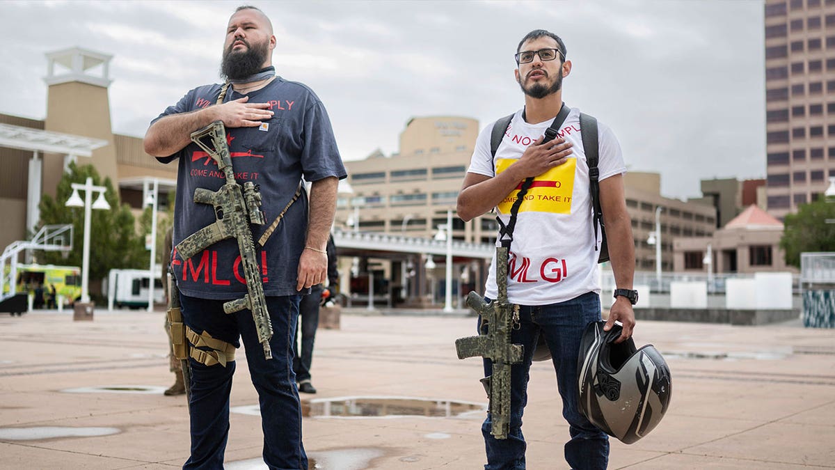 armed men pledge outside