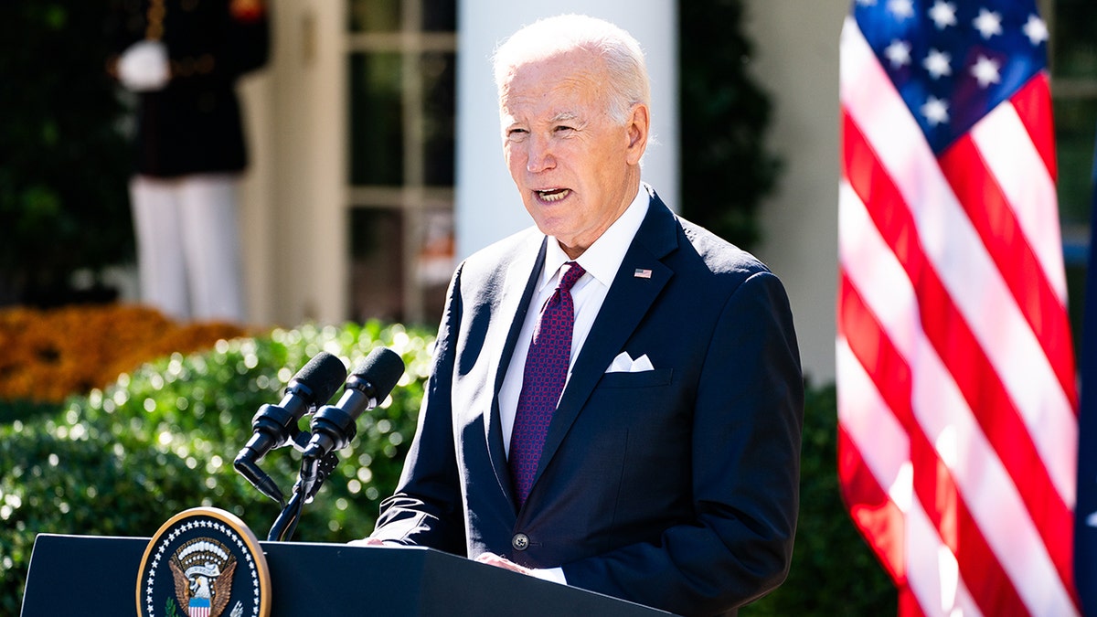 President Biden speaks from a podium at the White House