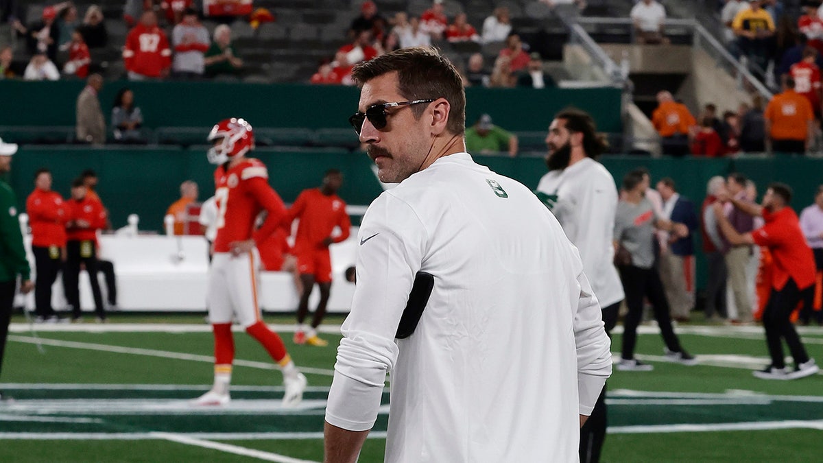 Aaron Rodgers on crutches