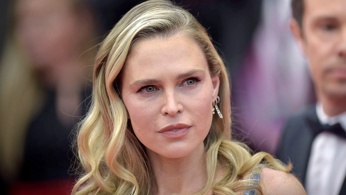 Sara Foster looks to her left as she looks demure on the carpet in Cannes