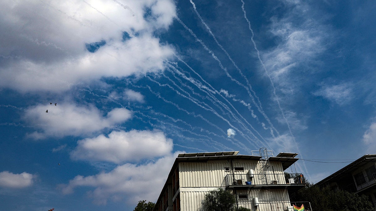 Missiles leave trails across blue sky over Sderot