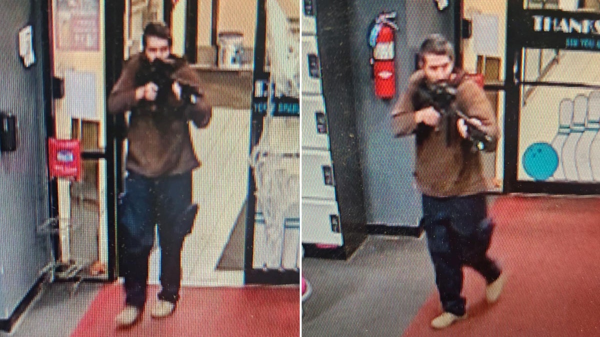 Picture of Maine shooting suspect entering building with a gun