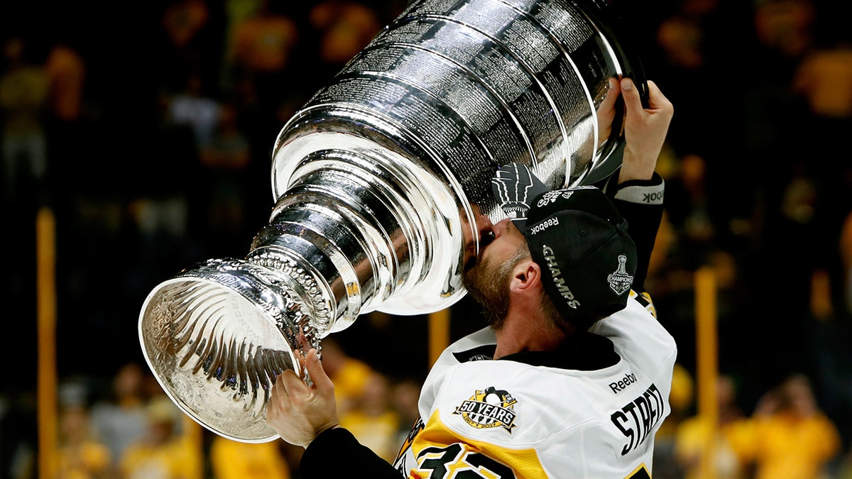 Mark Streit holds the cup