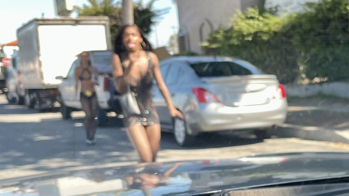 alleged prostitute on street seen from car