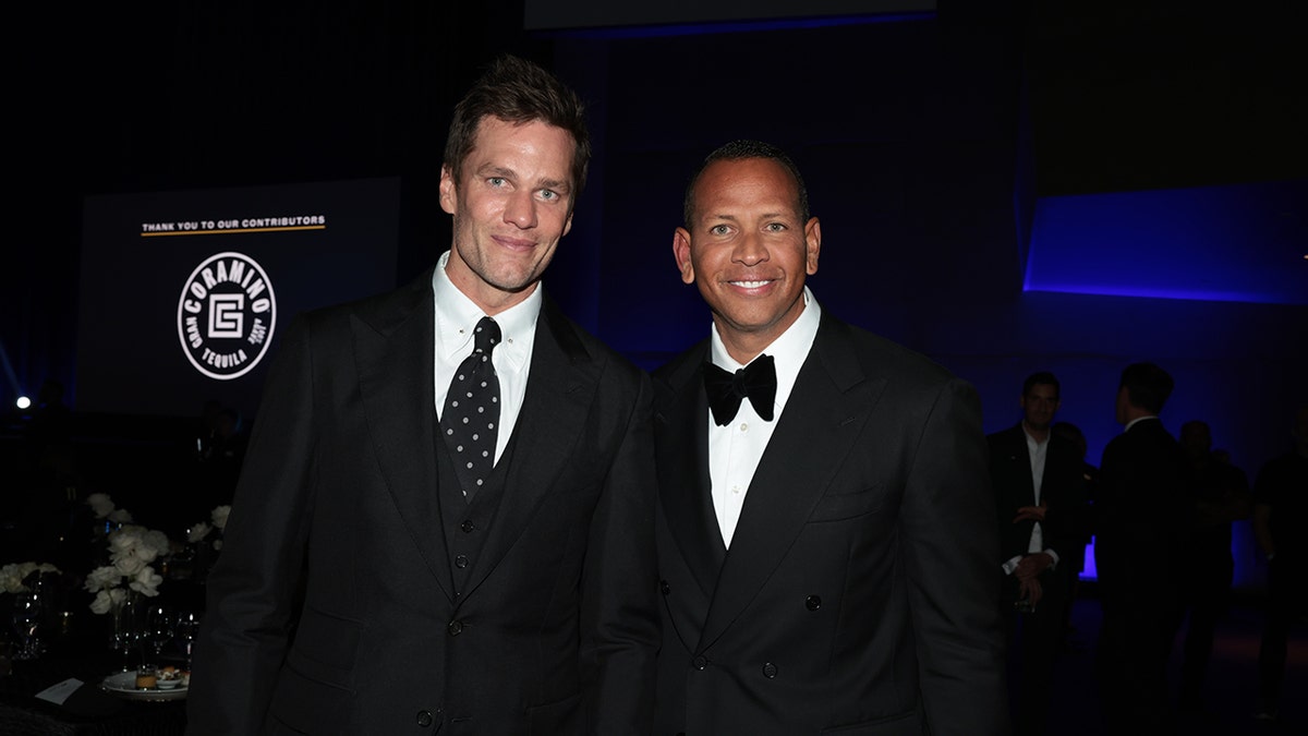 Tom Brady and Alex Rodriguez wear black suits at celebrity benefit