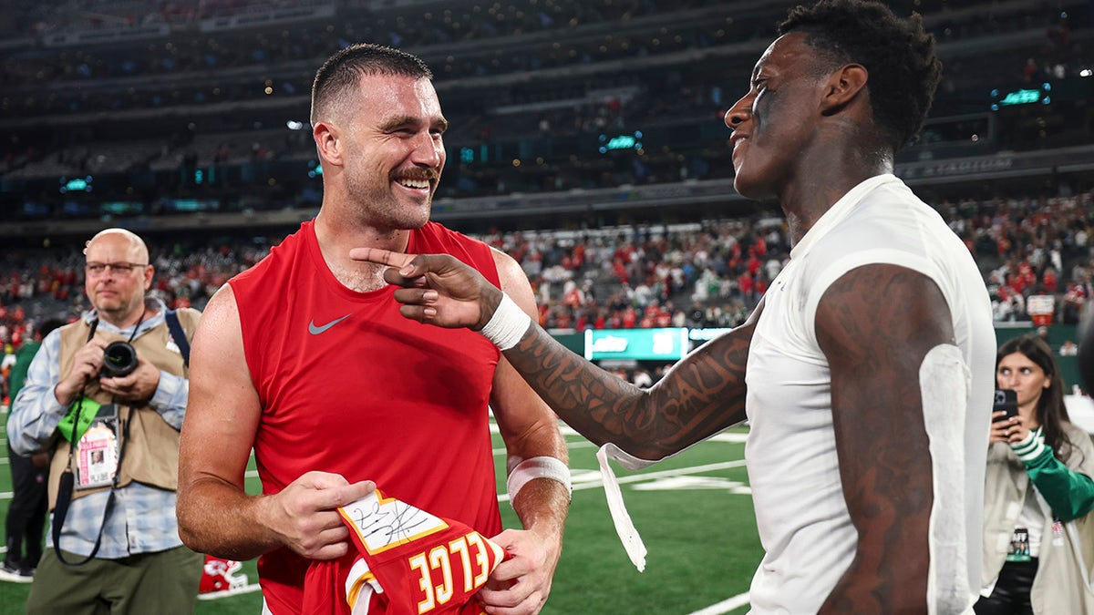 Travis Kelce and Sauce Gardner