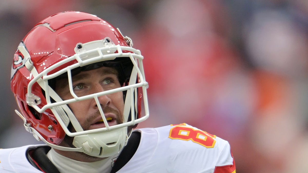 Travis Kelce looks on during an NFL game