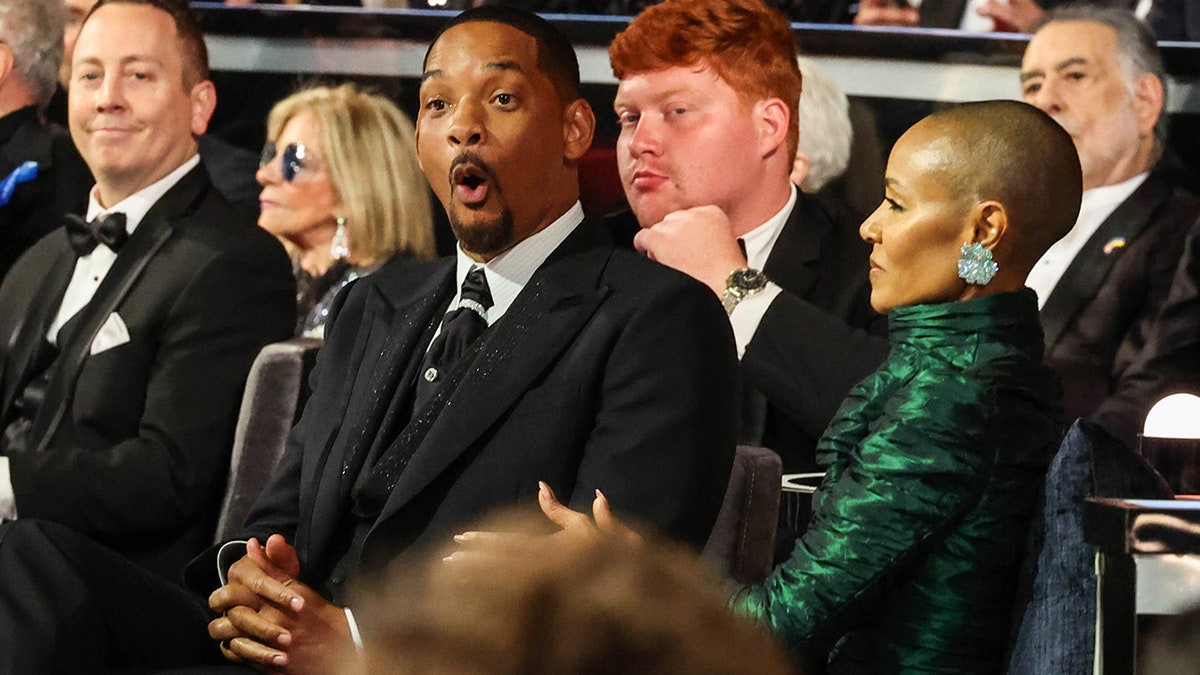 Will Smtih looks shocked at the Oscars while seated next to his wife Jada Pinkett Smith