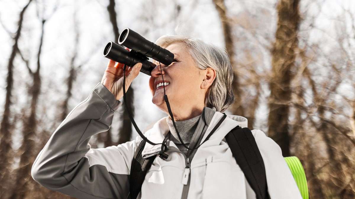 woman bird waching