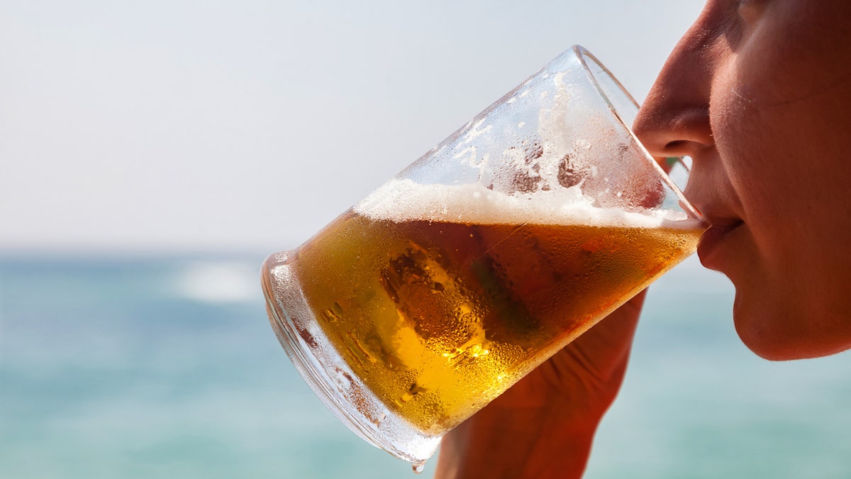 closeup of a woman drinking beer