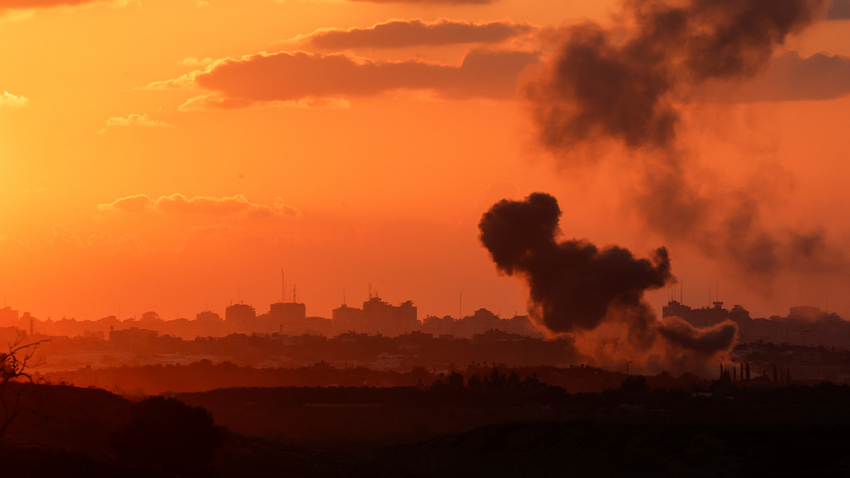 smoke over Gaza with dark orange sky