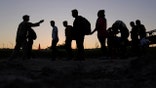 FILE - Migrants who crossed the Rio Grande and entered the U.S. from Mexico are lined up for processing by U.S. Customs and Border Protection, Saturday, Sept. 23, 2023, in Eagle Pass, Texas. (AP Photo/Eric Gay, File)