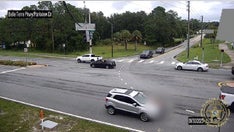 Florida hit-and-run suspect floors it as victim clings to hood for 2 miles with cops in hot pursuit: police