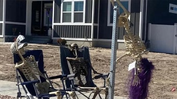 Halloween skeletons pole dancing on a stop sign cause uproar in Utah city: 'All in the name of fun'
