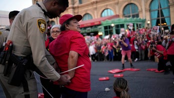 Las Vegas hotel workers arrested after disrupting traffic in labor dispute rally