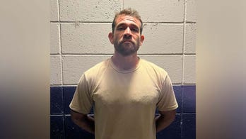 Oklahoma fugitive charged in wife's murder hauled home from Mexico after six years on the run