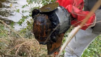 Fishermen find grenade in local river, leading to bomb squad arrival and controlled explosion