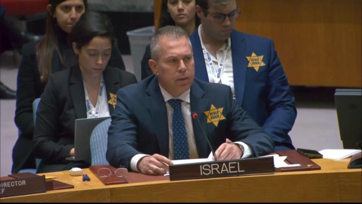 The Israeli Ambassador condemned the atrocities of Hamas and criticized the United Nations' silence. He said, "We will proudly walk alongside the Star of David until terrorists are denounced. We have vowed as a memorial that we will fight back for our defense."
