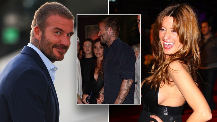 David Beckham waves to fans while walking the green carpet at the Earthshot Prize Awards