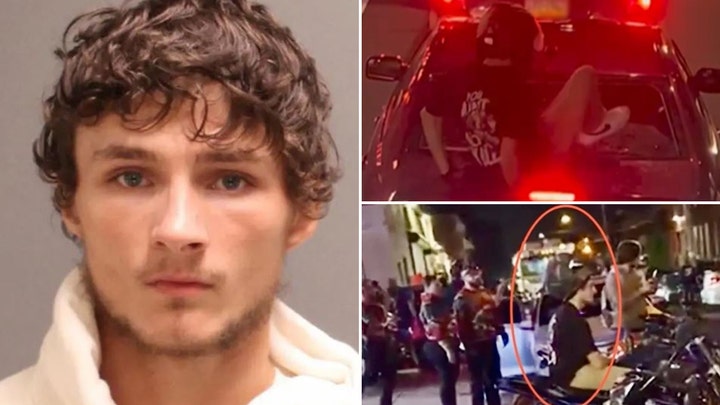 Biker suspect kicked the back of a car windshield