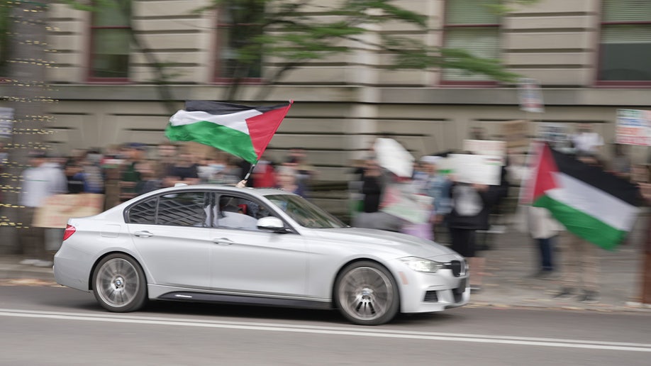 Car with Palestinian flag out window