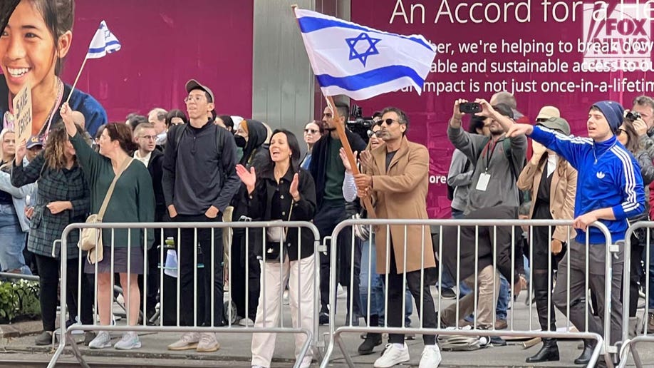 Protesters waving Israel flags