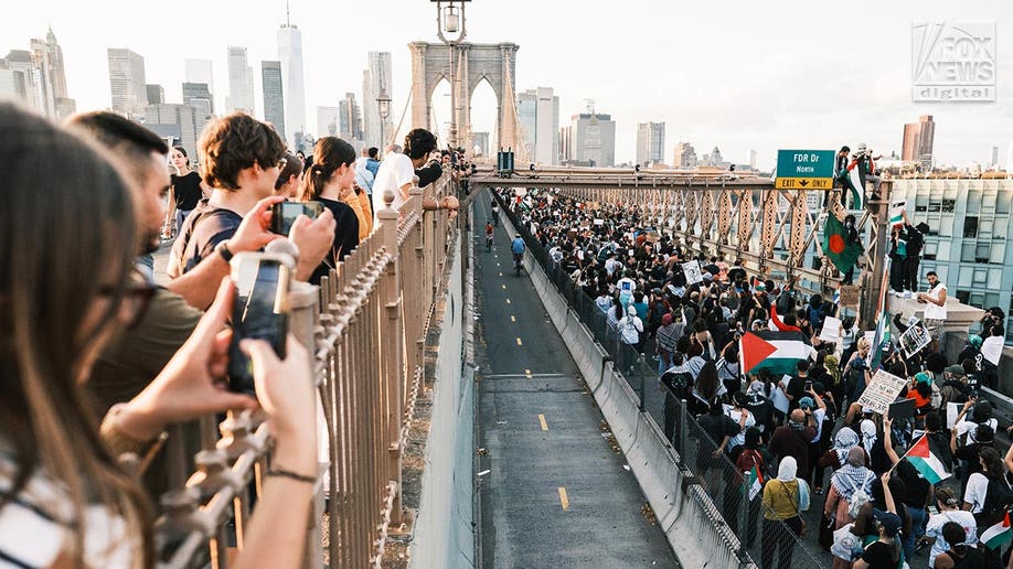 Pro Palestinian protesters scale part of Brooklyn Bridge force