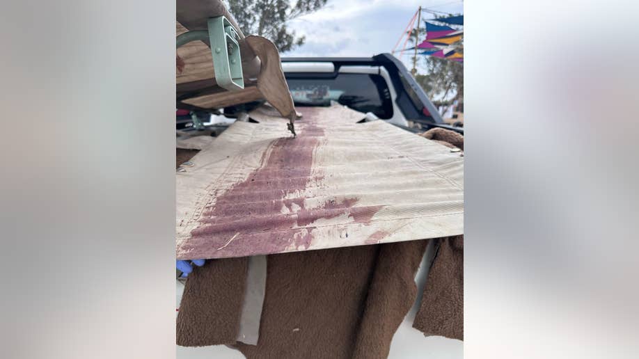 Stretcher stained with blood in a pickup truck