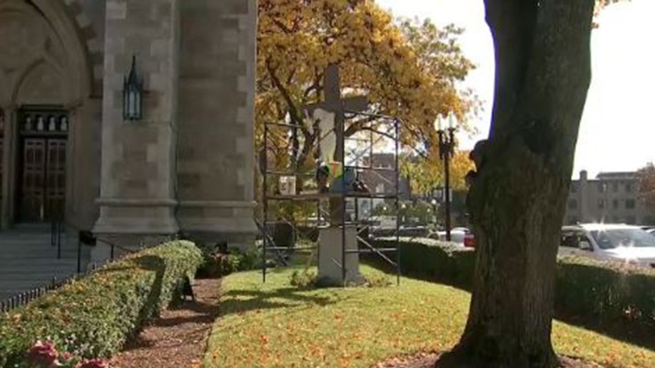 Crews repair crucifix outside Boston cathedral