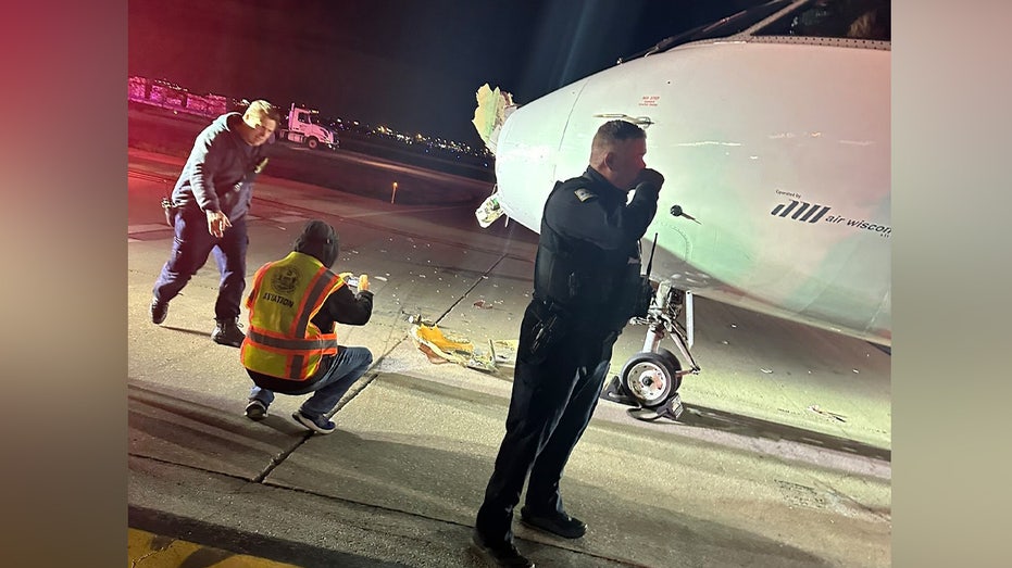 American Airlines regional plane collides with shuttle bus, injures two