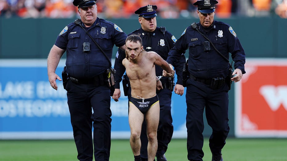 Field invader wearing 'Virginity Rocks' garment interrupts Orioles-Rangers playoff game