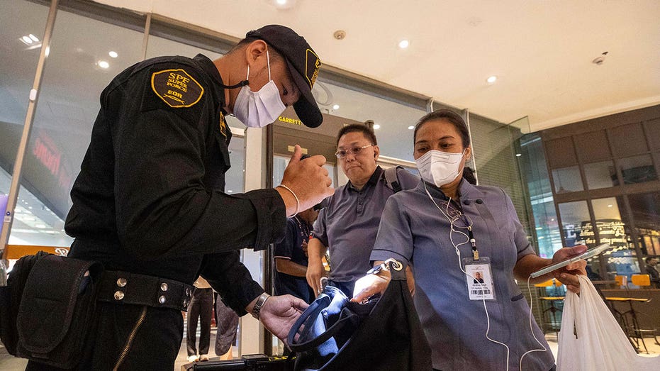 Thai teenager suspected of killing 2 in mall shooting used a modified blank-firing handgun, police say