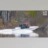 Law enforcement agents aid in the search for Robert Card along the Androscoggin River
