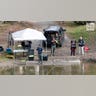 Law enforcement agents aid in the search for Robert Card along the Androscoggin River
