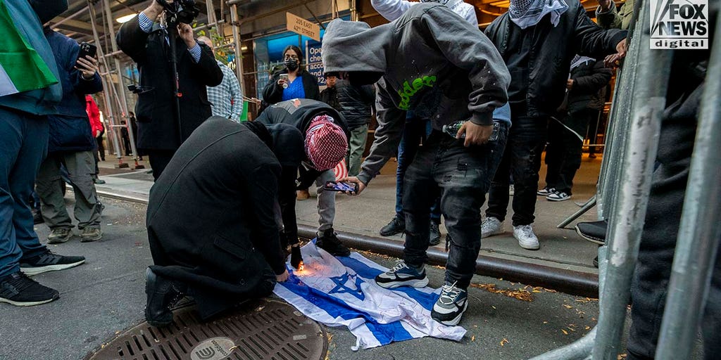 Pro-Palestinian protesters light Israel flag on fire in New York City, trample flyers for Hamas terror victims - Vimarsana News