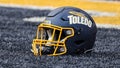 A Toledo football helmet is seen sitting on the turf in the end zone before the start of a Mid-American Conference regular season college football game between the Central Michigan Chippewas and the Toledo Rockets on October 1, 2022 at Glass Bowl Stadium in Toledo, Ohio.