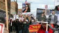 People protest against the possible construction of a winterized tent camp for migrants on a vacant lot on California Avenue, march down Archer Avenue in Chicago's Brighton Park neighborhood on Friday, Nov. 10, 2023. (Terrence Antonio James/Chicago Tribune/Tribune News Service via Getty Images)