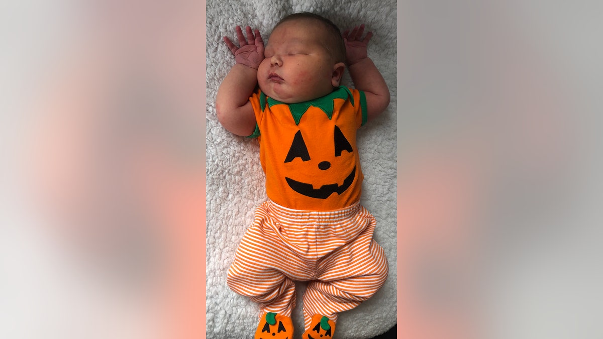 14-pound baby in pumpkin onezie