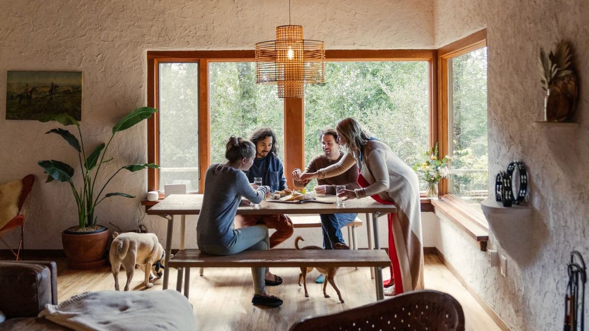 Family enjoying a meal at the table.