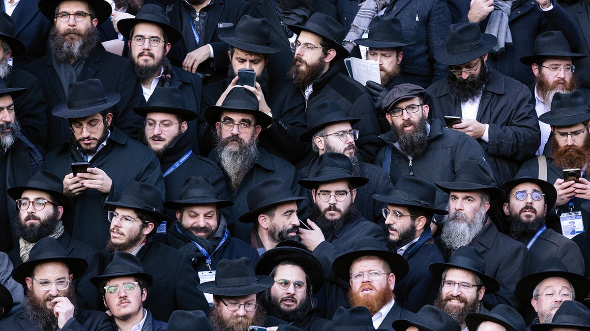Thousands of rabbis pose in front of Chabad-Lubavitch world headquarters in Brooklyn, New York, at the 2022 International Conference of Chabad-Lubavitch Emissaries. The event draws about 6,500 rabbis annually; it returns to New York City on Nov. 9, 2023, amid a spiritual renewal among Jews in wake of the Oct. 7 terror attacks in Israel. 