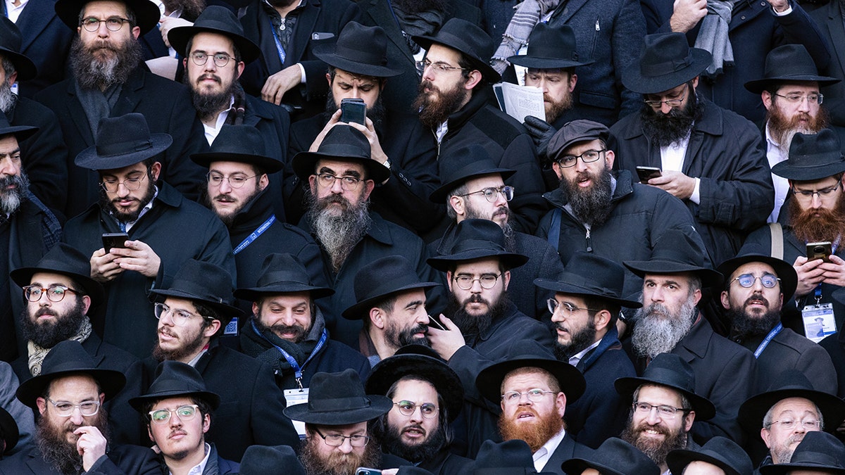 Thousands of rabbis pose in front of Chabad-Lubavitch world headquarters in Brooklyn, New York, at the 2022 International Conference of Chabad-Lubavitch Emissaries. The event draws about 6,500 rabbis annually; it returns to New York City on Nov. 9, 2023, amid a spiritual renewal among Jews in wake of the Oct. 7 terror attacks in Israel.?