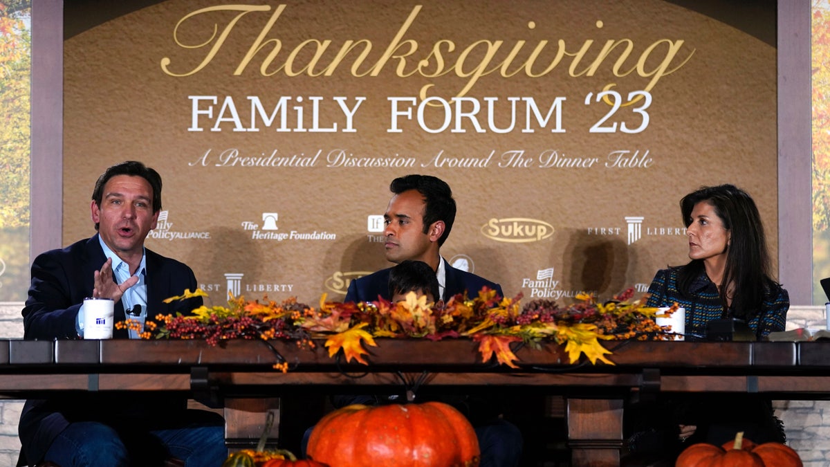 Gov. Ron DeSantis, left, speaks during the Family Leader's Thanksgiving Family Forum