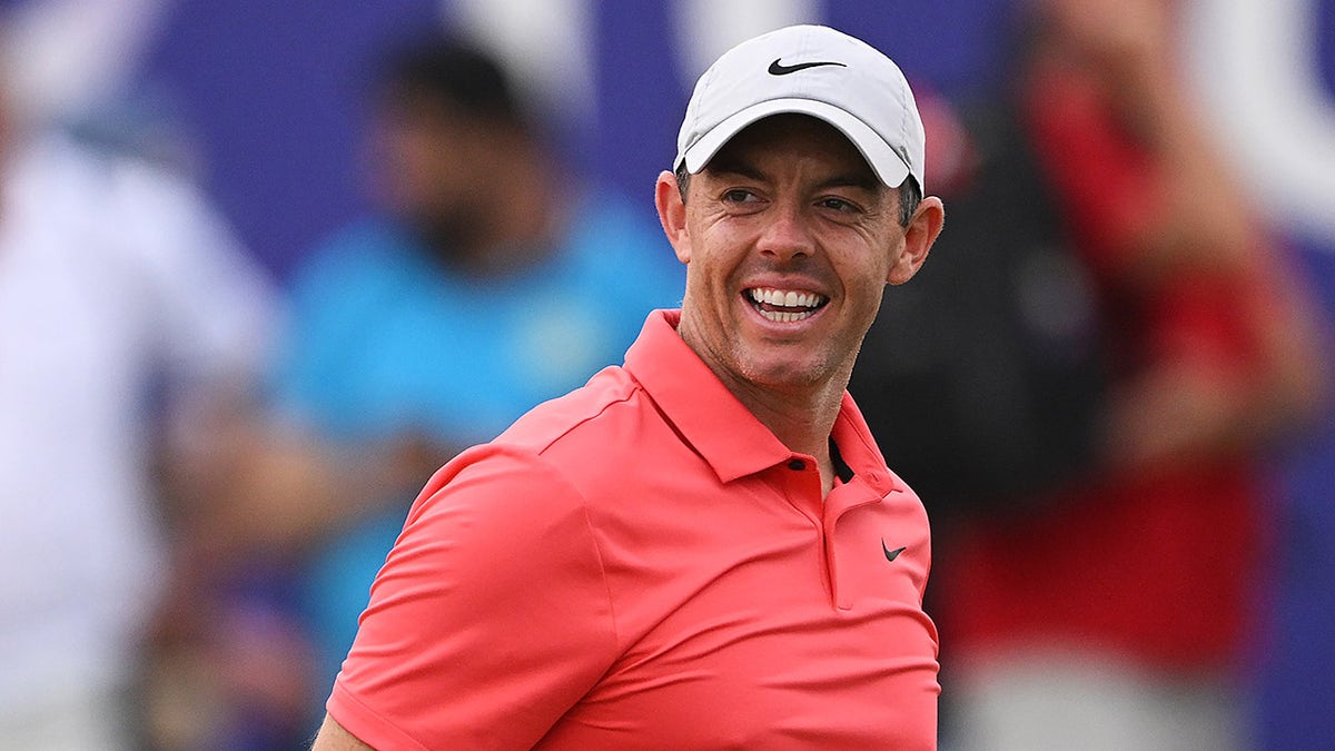 Rory McIlroy smiles after the 18th hole