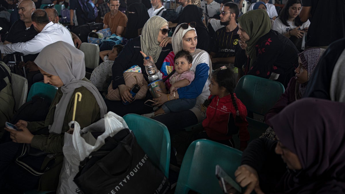 crowds of people trying to leave Gaza