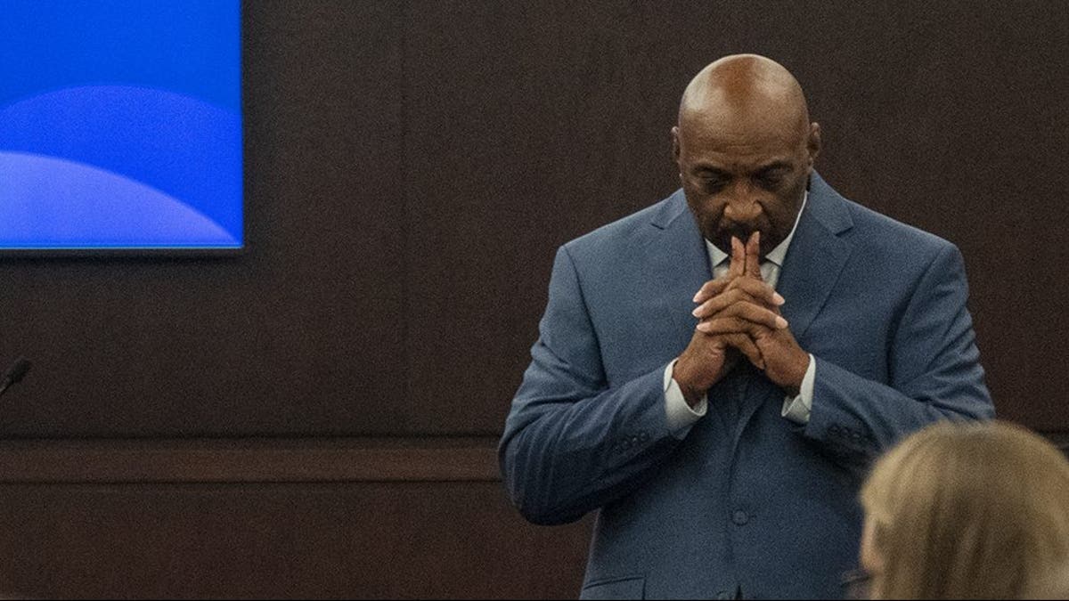 Travis County prosecutor Rickey Jones lowers his head during opening statements