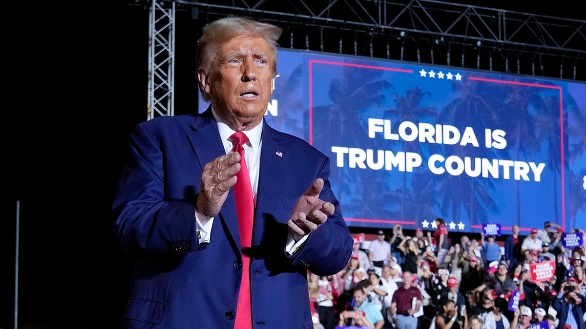 Trump claps on Hialeah rally stage