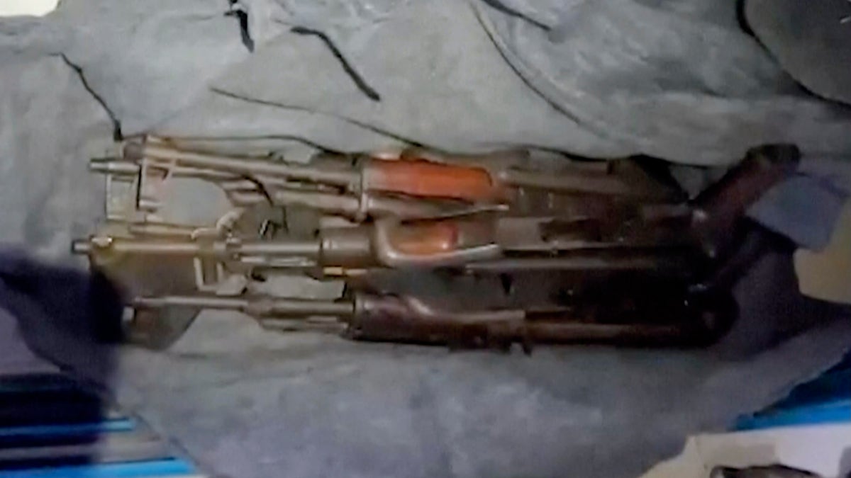Several rifles seen inside a Gaza hospital