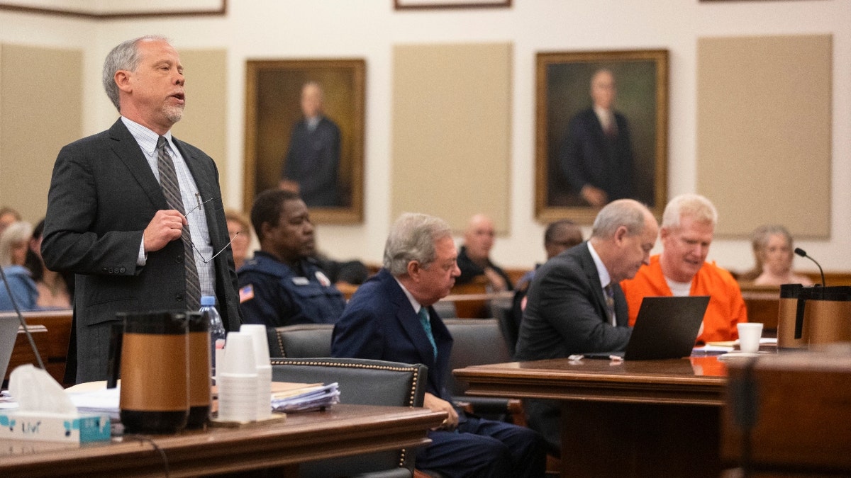 Prosecutor Creighton Waters, left, addresses the court during Alex Murdaugh's sentencing for stealing from 18 clients, Tuesday, Nov. 28, 2023, at the Beaufort County Courthouse in Beaufort, S.C.